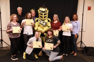 Members of the Knighted Faculty Program pose with their certificates.